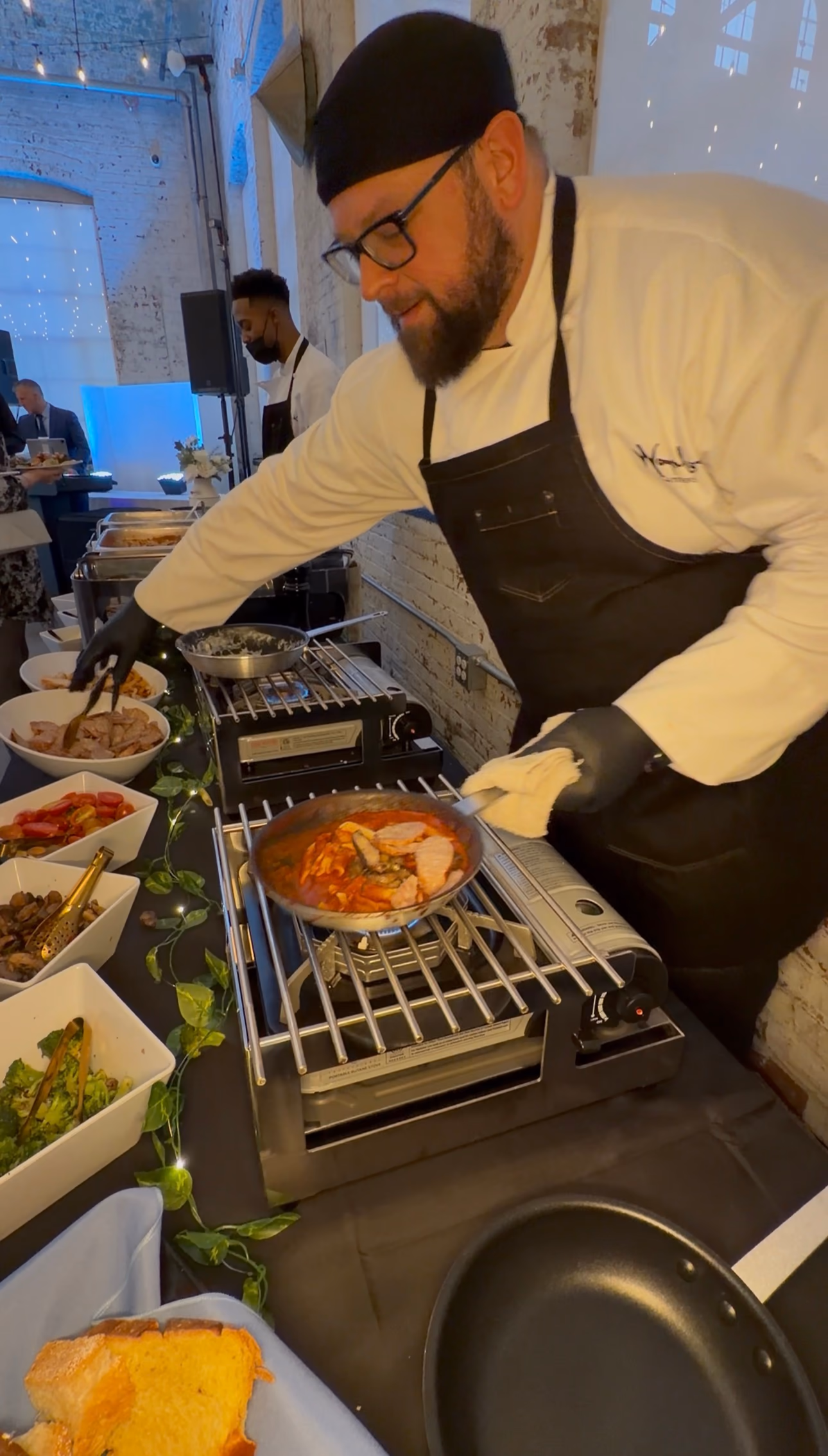 Chef cooking at a live kitchen station