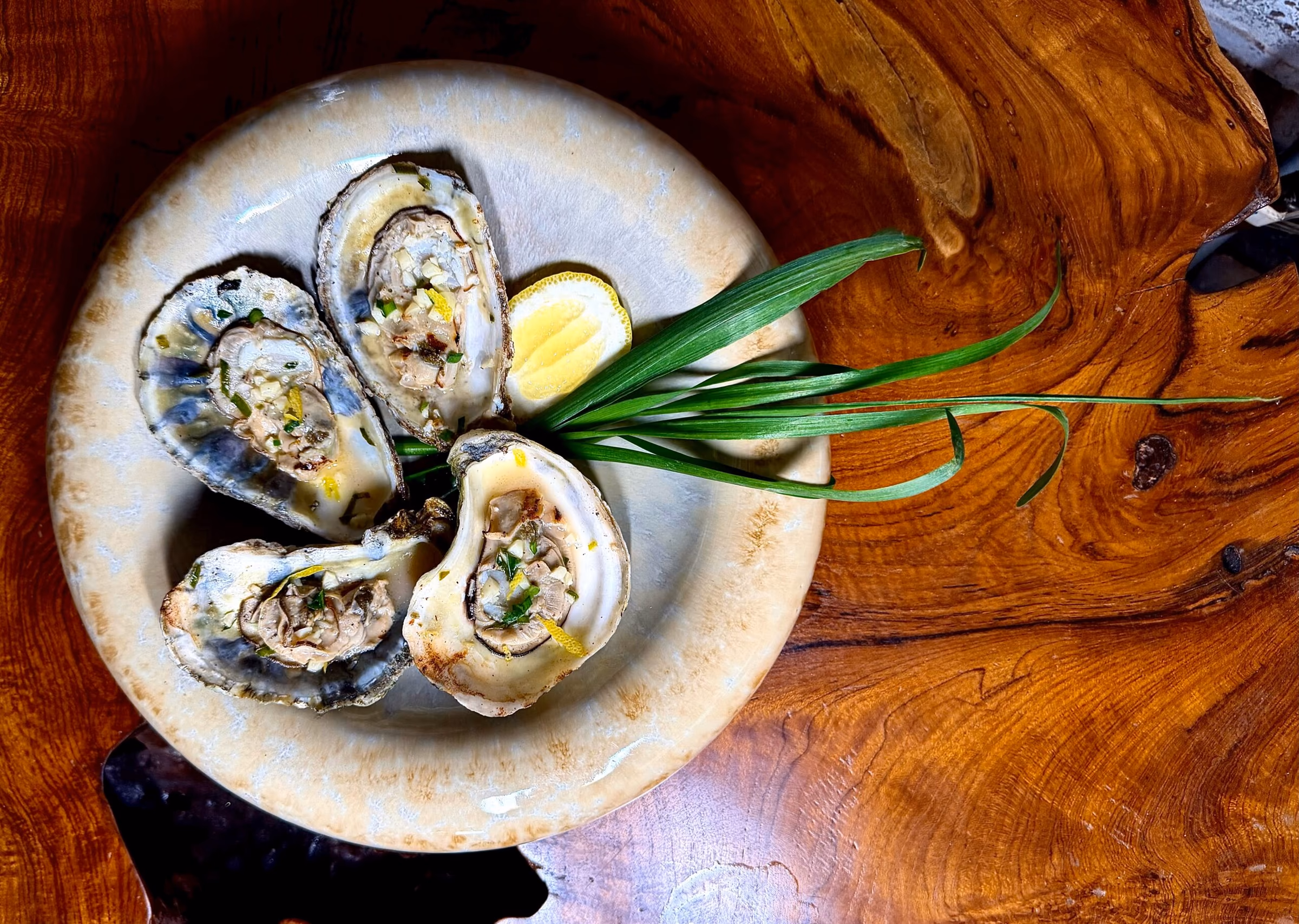 Oysters on the half shell with scallion